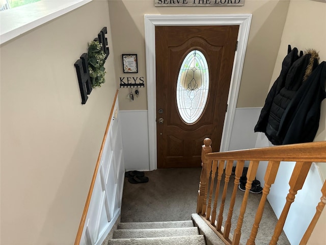 179 Clinton Ave, East Patchogue, NY 11772 - entrance foyer with carpet floors, stairway, and wainscoting