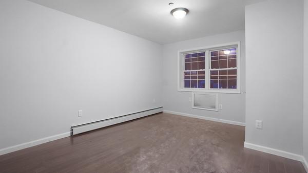2040 Washington Ave, Bronx, NY 10457 - spare room with baseboard heating and baseboards