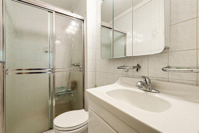 69-10 108th St Unit 1N, Forest Hills, NY 11375 - full bath with tile walls, a stall shower, vanity, and decorative backsplash