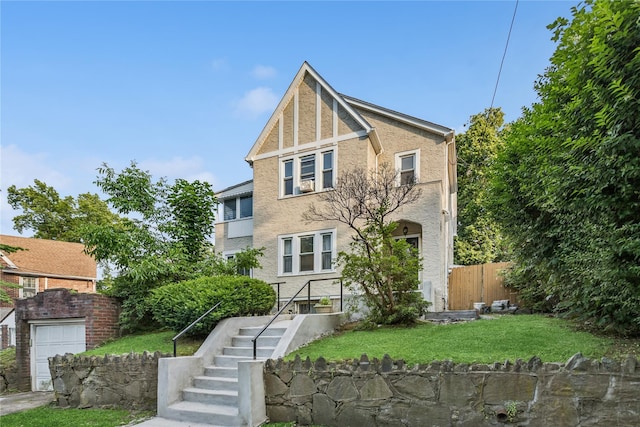 222 E 4th St, Mount Vernon, NY 10553 - tudor house featuring stucco siding and a garage