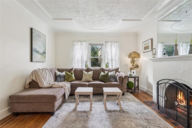 222 E 4th St, Mount Vernon, NY 10553 - living room with ornamental molding, wood finished floors, a fireplace, and a textured ceiling