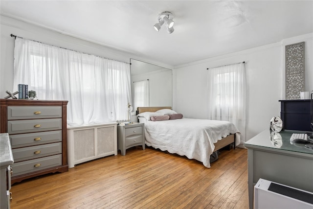 222 E 4th St, Mount Vernon, NY 10553 - bedroom with radiator, light wood finished floors, and ornamental molding