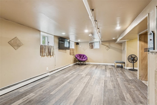 222 E 4th St, Mount Vernon, NY 10553 - basement with a baseboard radiator, wood finished floors, plenty of natural light, and recessed lighting