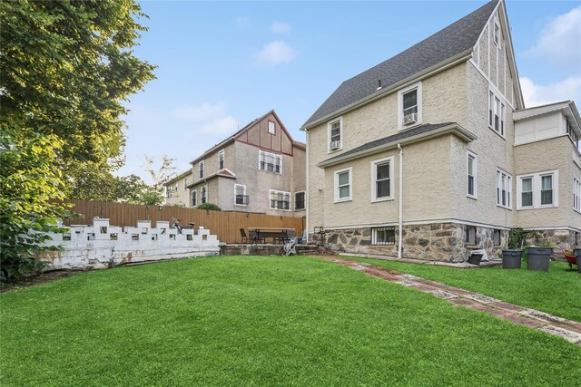 222 E 4th St, Mount Vernon, NY 10553 - back of property with stone siding and roof with shingles