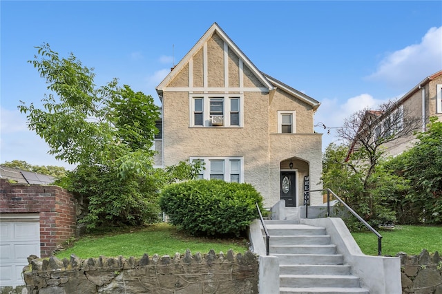 222 E 4th St, Mount Vernon, NY 10553 - tudor-style house with stucco siding and a front lawn