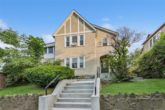 222 E 4th St, Mount Vernon, NY 10553 - view of front of home with stucco siding and a front yard