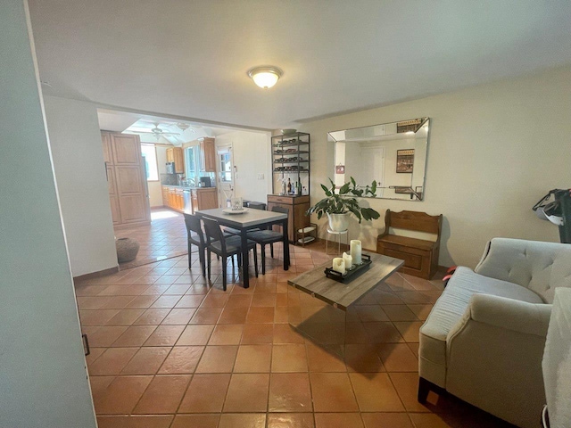 390 Atlantic Ave, East Rockaway, NY 11518 - dining area featuring light tile patterned floors and a ceiling fan