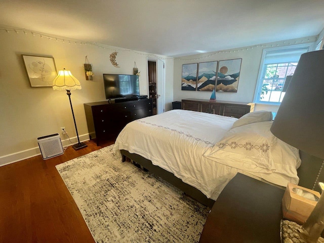 390 Atlantic Ave, East Rockaway, NY 11518 - bedroom featuring wood finished floors and baseboards