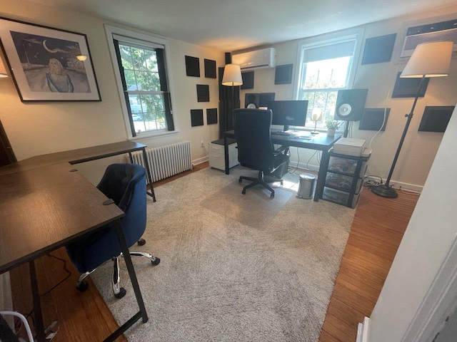 390 Atlantic Ave, East Rockaway, NY 11518 - office space featuring radiator heating unit, wood finished floors, a wall mounted air conditioner, and a wall unit AC