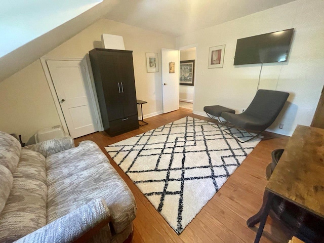 390 Atlantic Ave, East Rockaway, NY 11518 - living room featuring wood finished floors and lofted ceiling