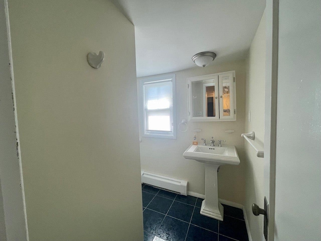390 Atlantic Ave, East Rockaway, NY 11518 - bathroom with a baseboard radiator and tile patterned floors