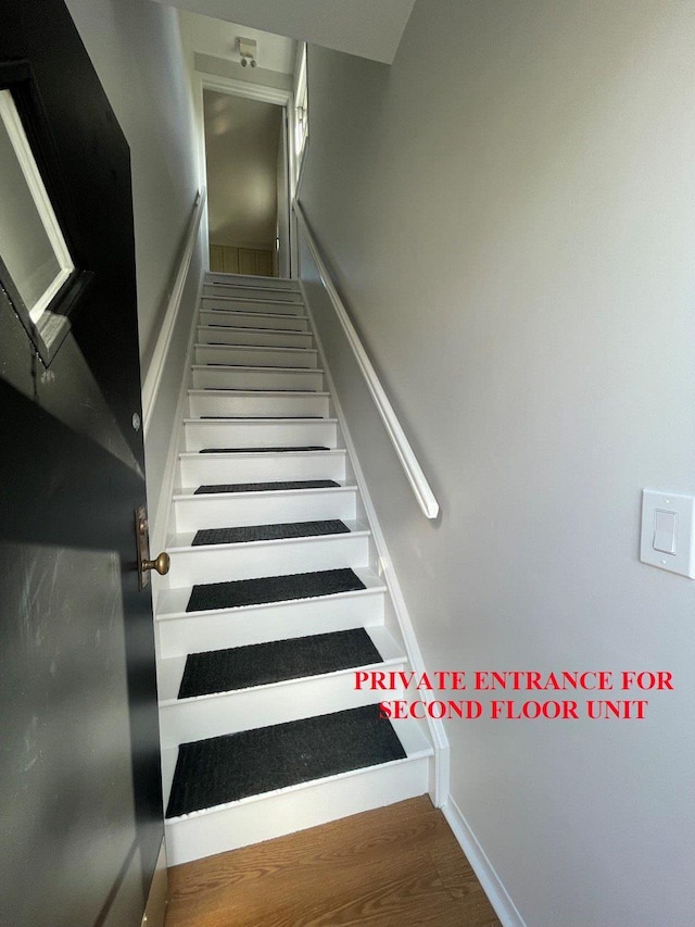 390 Atlantic Ave, East Rockaway, NY 11518 - staircase featuring wood finished floors