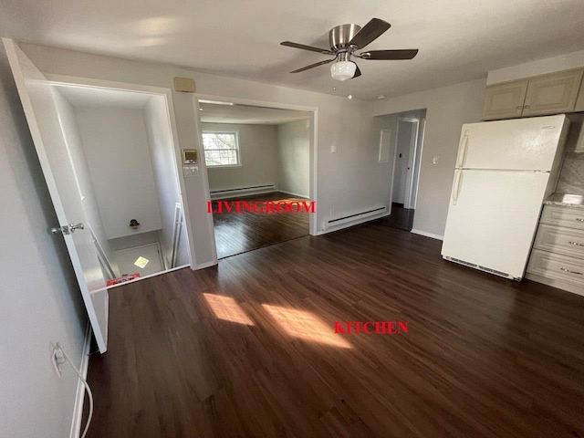 390 Atlantic Ave, East Rockaway, NY 11518 - unfurnished bedroom with freestanding refrigerator, a baseboard radiator, dark wood finished floors, and ceiling fan