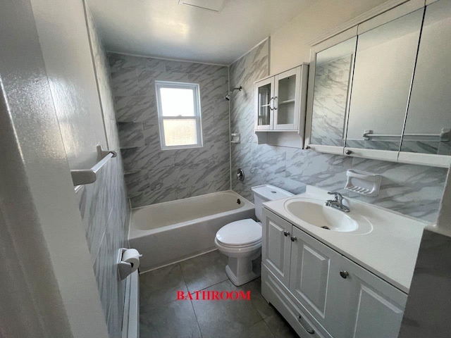 390 Atlantic Ave, East Rockaway, NY 11518 - bathroom featuring vanity, washtub / shower combination, and tile patterned flooring