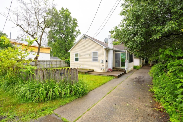 10 Tobacco Ln, Red Hook, NY 12571 - view of front facade featuring a wooden deck and a chimney