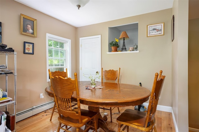 10 Tobacco Ln, Red Hook, NY 12571 - dining area with a baseboard heating unit and light wood-style floors