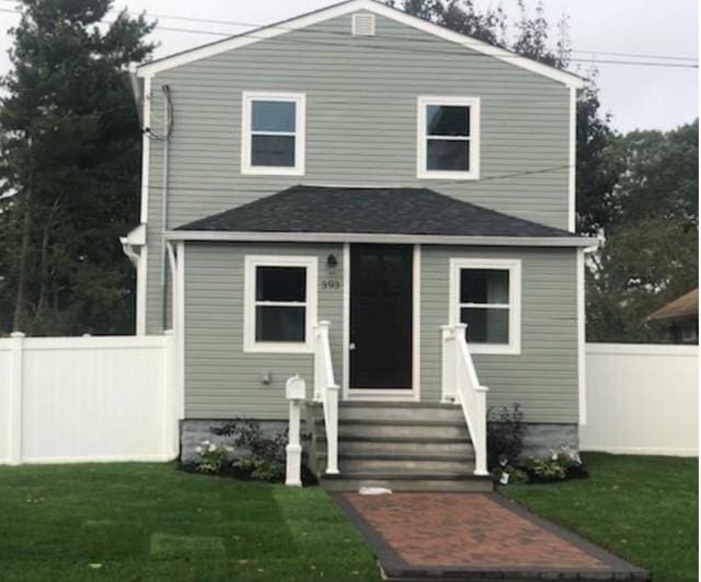 393 S 4th St, Lindenhurst, NY 11757 - view of front facade with entry steps and roof with shingles