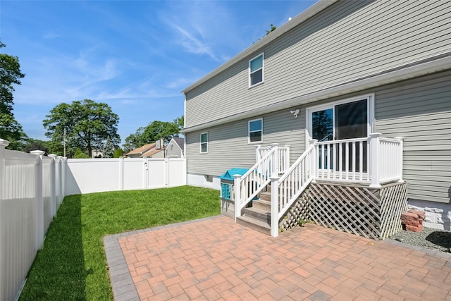 393 S 4th St, Lindenhurst, NY 11757 - back of property with a patio and a fenced backyard