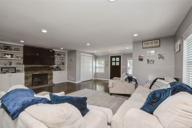 393 S 4th St, Lindenhurst, NY 11757 - living room featuring wood finished floors, recessed lighting, a fireplace, and built in features