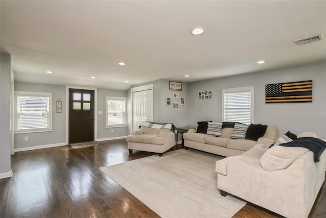 393 S 4th St, Lindenhurst, NY 11757 - living room with recessed lighting and dark wood-style flooring