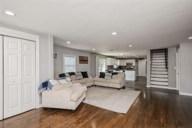 393 S 4th St, Lindenhurst, NY 11757 - living room featuring recessed lighting, stairs, and dark wood-style flooring