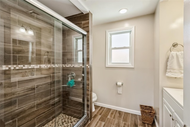 393 S 4th St, Lindenhurst, NY 11757 - bathroom with vanity, a stall shower, and wood tiled floors