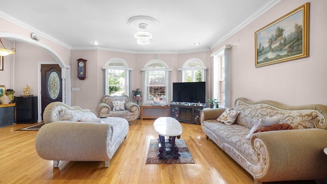 89-10 189th St, Hollis, NY 11423 - living room featuring ornamental molding, light wood-style flooring, arched walkways, and recessed lighting
