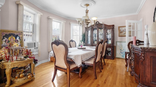89-10 189th St, Hollis, NY 11423 - dining space with a chandelier, light wood-style floors, crown molding, and cooling unit