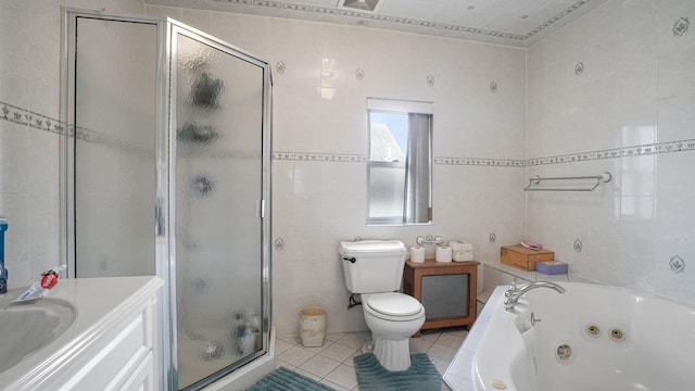 89-10 189th St, Hollis, NY 11423 - bathroom with tile walls, tile patterned floors, a stall shower, a jetted tub, and vanity