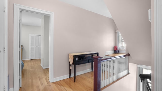 89-10 189th St, Hollis, NY 11423 - corridor featuring an upstairs landing, light wood-style flooring, and plenty of natural light