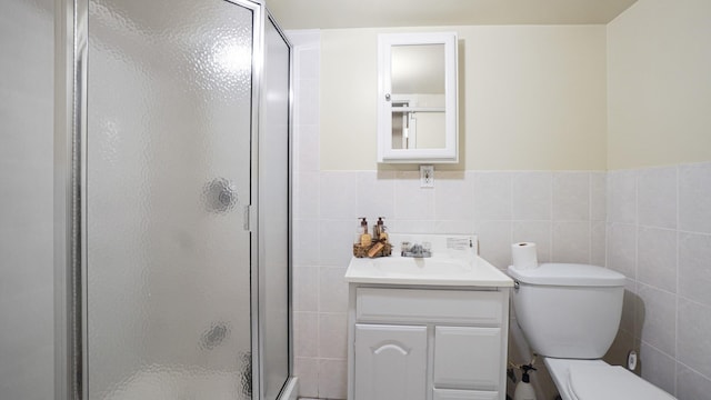 89-10 189th St, Hollis, NY 11423 - full bath featuring a shower stall, vanity, tile walls, and wainscoting
