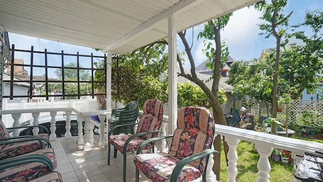 89-10 189th St, Hollis, NY 11423 - sunroom featuring tile patterned floors, expansive windows, and plenty of natural light