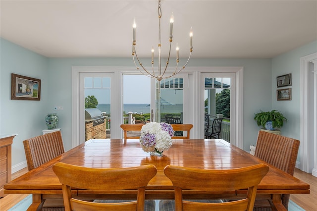 4510 Peconic Bay Blvd, Laurel, NY 11948 - dining area featuring a chandelier and light wood finished floors