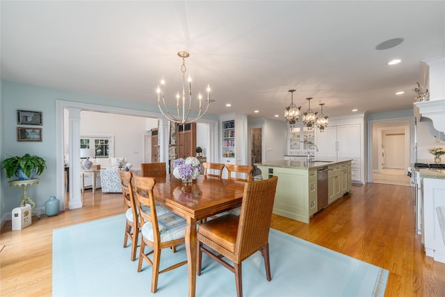 4510 Peconic Bay Blvd, Laurel, NY 11948 - dining room featuring a chandelier, light wood-style flooring, and recessed lighting