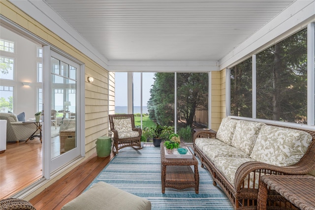 4510 Peconic Bay Blvd, Laurel, NY 11948 - sunroom with an outdoor living space, hardwood / wood-style flooring, plenty of natural light, and a water view