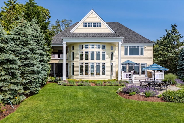 4510 Peconic Bay Blvd, Laurel, NY 11948 - rear view of property with a lawn, a shingled roof, and a patio