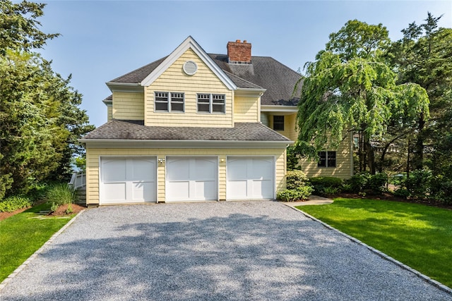 4510 Peconic Bay Blvd, Laurel, NY 11948 - view of front facade with a chimney, a front lawn, driveway, and roof with shingles