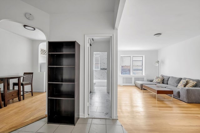 63-60 102nd St Unit A8, Rego Park, NY 11374 - living area with arched walkways and tile patterned flooring