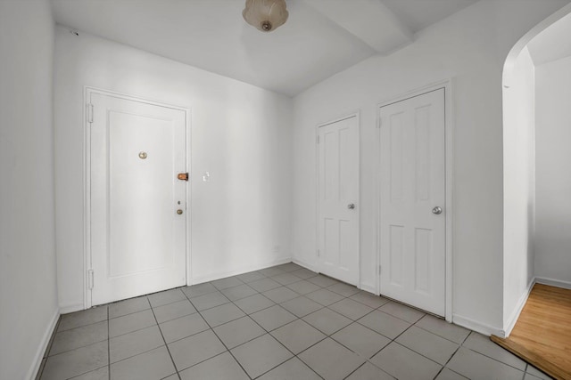63-60 102nd St Unit A8, Rego Park, NY 11374 - foyer entrance with arched walkways and light tile patterned floors