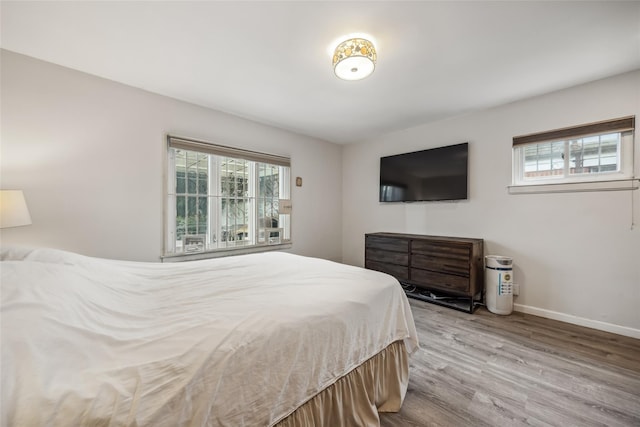 213-09 64th Ave, Oakland Gardens, NY 11364 - bedroom featuring multiple windows and wood finished floors