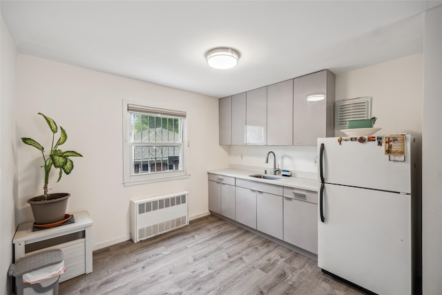213-09 64th Ave, Oakland Gardens, NY 11364 - kitchen featuring freestanding refrigerator, radiator, gray cabinets, light wood finished floors, and light countertops