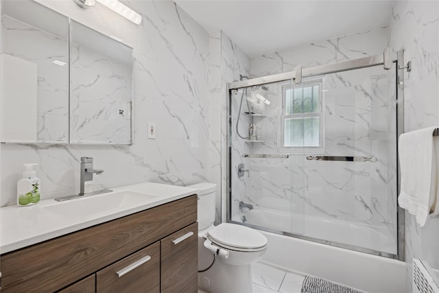 213-09 64th Ave, Oakland Gardens, NY 11364 - bathroom with marble finish flooring, vanity, and bath / shower combo with glass door