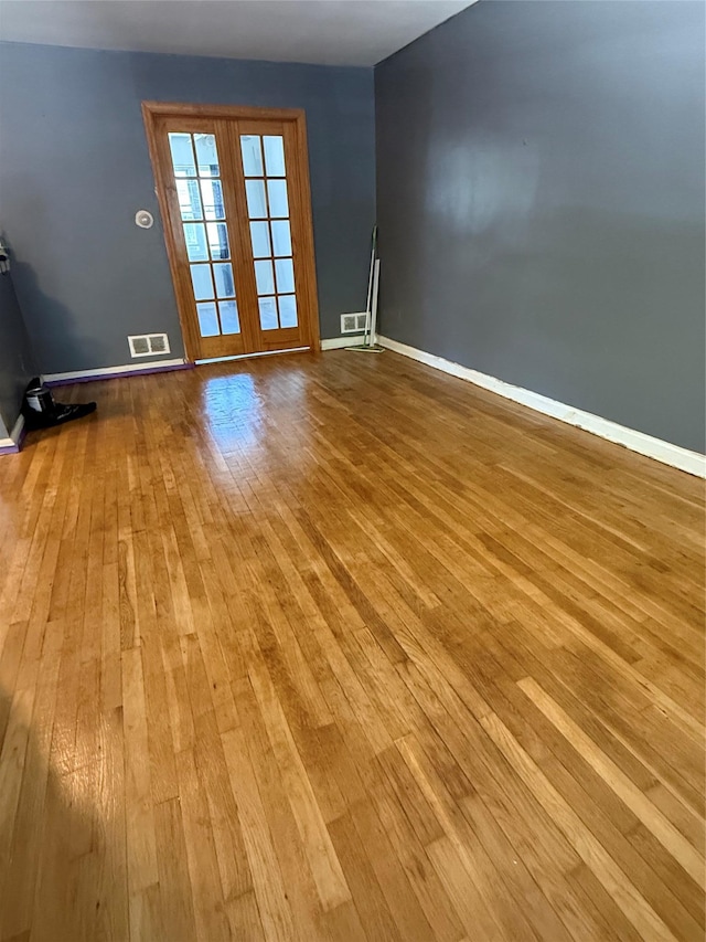 1319 Hicks St, Bronx, NY 10469 - spare room with wood-type flooring and baseboards