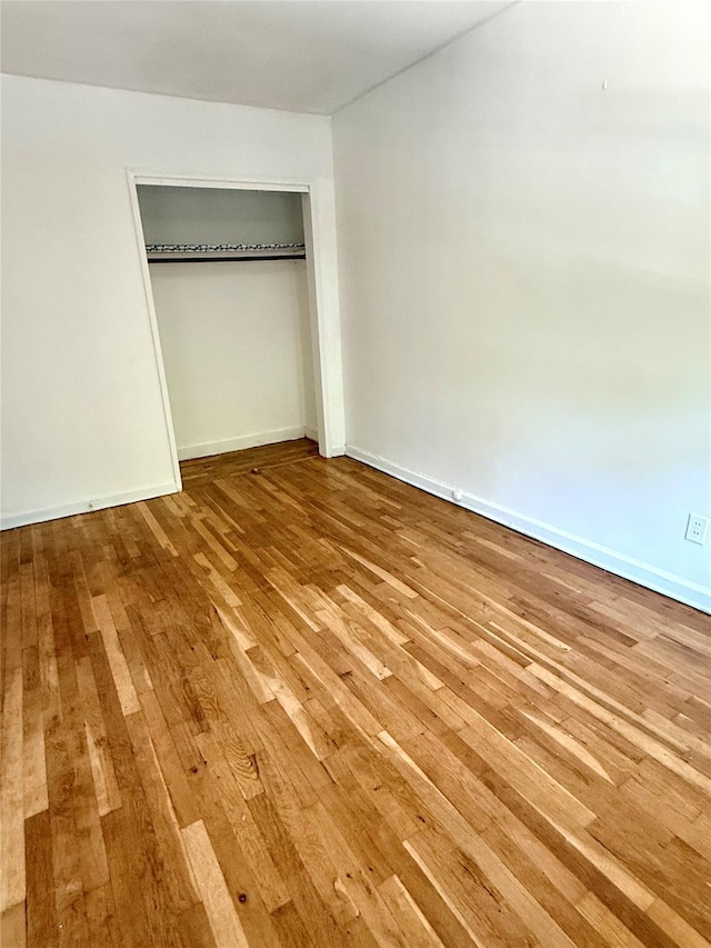 1319 Hicks St, Bronx, NY 10469 - unfurnished bedroom with wood-type flooring and a closet