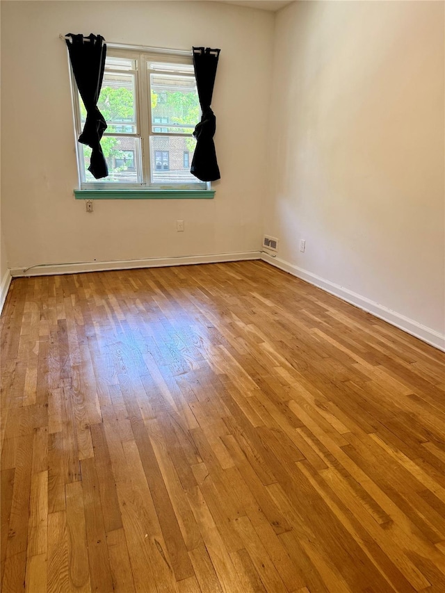 1319 Hicks St, Bronx, NY 10469 - spare room with hardwood / wood-style flooring and baseboards
