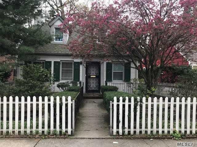 85-24 Eton St, Jamaica Estates, NY 11432 - view of property hidden behind natural elements with a fenced front yard