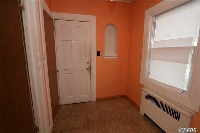 85-24 Eton St, Jamaica Estates, NY 11432 - hall with radiator heating unit and baseboards
