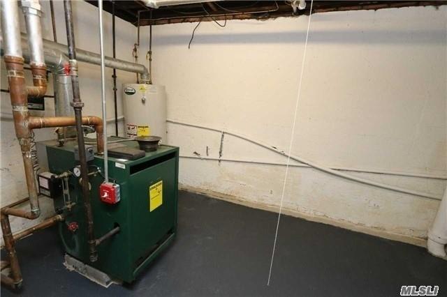 85-24 Eton St, Jamaica Estates, NY 11432 - utility room with gas water heater and a heating unit