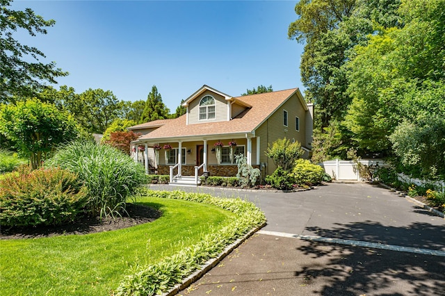 122 Cambon Ave, Saint James, NY 11780 - view of front of property featuring a porch, asphalt driveway, roof with shingles, and a gate