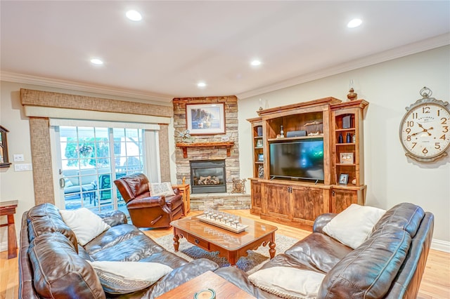 122 Cambon Ave, Saint James, NY 11780 - living room with light wood-style floors, ornamental molding, a stone fireplace, and recessed lighting